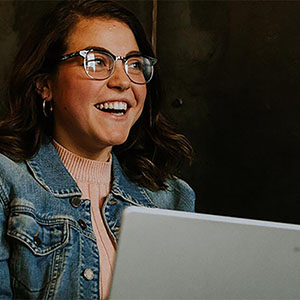 educational leadership student working on laptop