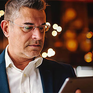 business administration professional looking at tablet